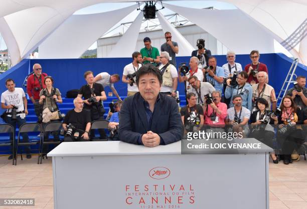 Japanese director Kore-Eda Hirokazu poses on May 18, 2016 during a photocall for the film "After the Storm " at the 69th Cannes Film Festival in...