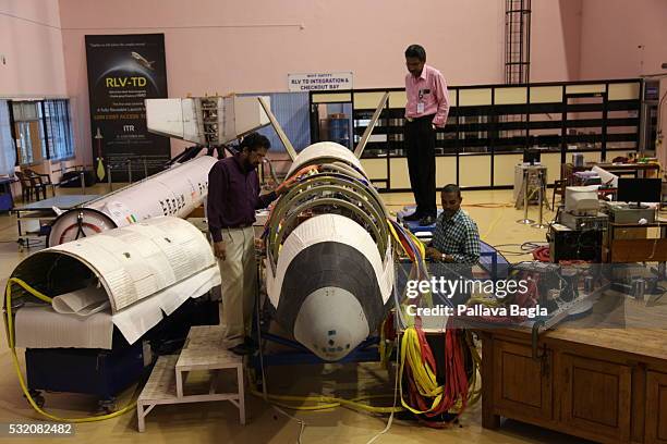 Scientists and technicians work on India’s first re-usable Launch Vehicle or 'Space Shuttle' sits in a laboratory at Vikram Sarabhai Space Center on...