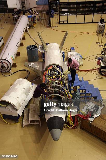 Scientists and technicians work on India’s first re-usable Launch Vehicle or 'Space Shuttle' sits in a laboratory at Vikram Sarabhai Space Center on...