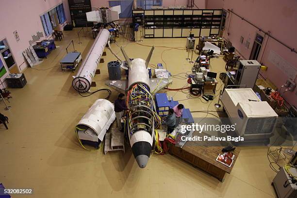 Scientists and technicians work on India’s first re-usable Launch Vehicle or 'Space Shuttle' sits in a laboratory at Vikram Sarabhai Space Center on...
