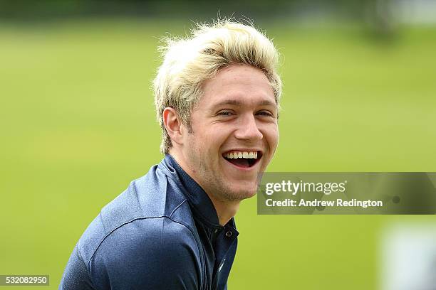 Singer Niall Horan of One Direction practices on the range during a Pro-Am round prior to the start of the Dubai Duty Free Irish Open Hosted by the...