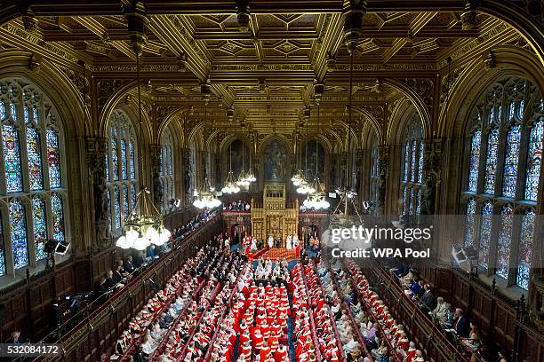 Queen Elizabeth II delivers the Queen's Speech from the throne as Prince Philip, Duke of Edinburgh, Prince Charles, Prince of Wales and Camilla,...