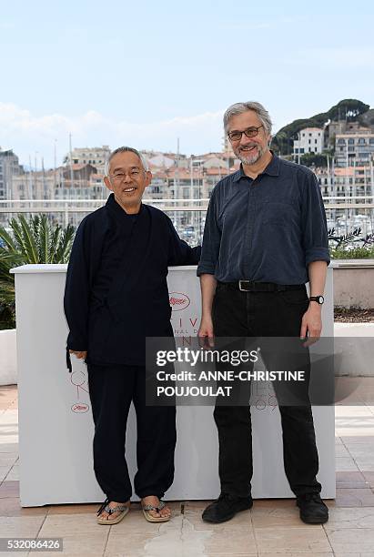 Japanese producer Toshio Suzuki and Dutch director Michael Dudok de Wit pose on May 18, 2016 during a photocall for the film "The Red Turtle" at the...