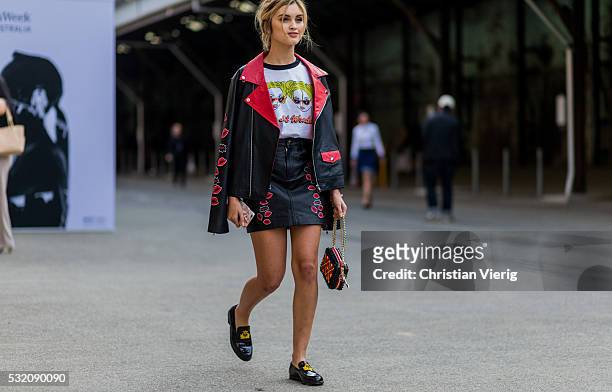 Sarah Ellen wearing a black red leather jacket and leather skirt and black Christian Louboutin loafers outside Emma Mulholland at Mercedes-Benz...