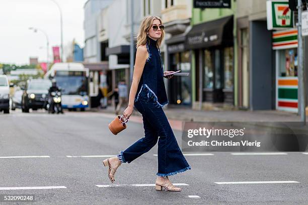 Carmen Hamilton wearing a navy denim jeans and sleeveless denim top from Marques Almeida outside Kitx at Mercedes-Benz Fashion Week Resort 17...