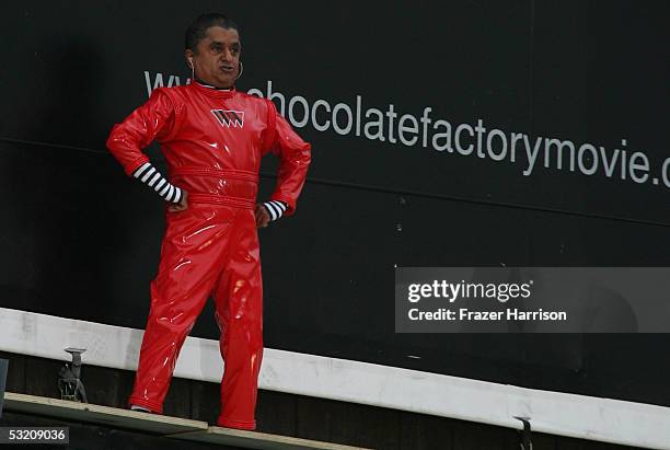 Actor Deep Roy who plays an Oompa Loompa in "Charlie and the Chocolate Factory" dances on the movie billboard ahead of the upcoming July 15 movie...