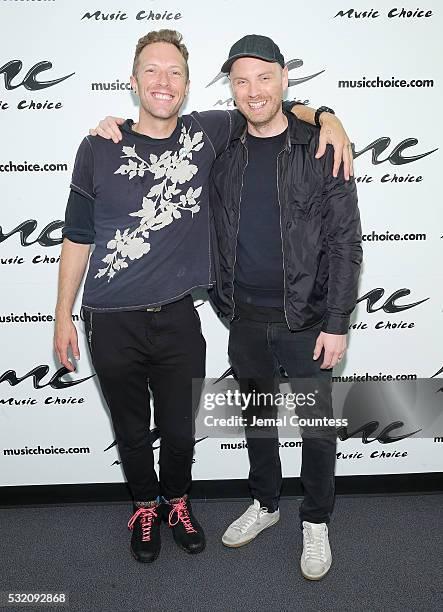 Musicians Chris Martin and Jonny Buckland of the band Coldplay pose for a photo during a visit to Music Choice at Music Choice on May 18, 2016 in New...