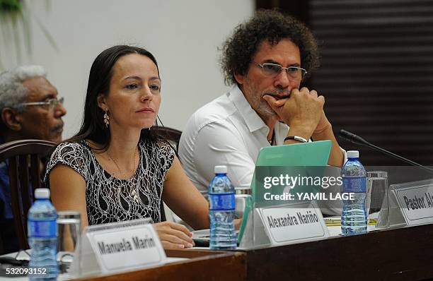 Members of FARC-EP delegation, Dutch guerrilla fighter Tanja Nijmeijer and Commander Pastor Alape participate in a meeting with former guerrilla...