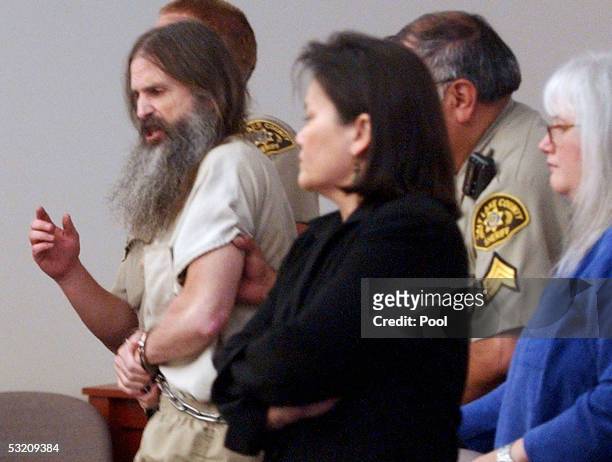 Brian David Mitchell is escorted out of 3rd District Court of Judge Judith Atherton during his competency hearing after shouted a Biblical admonition...