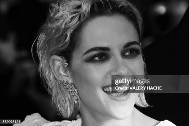 Actress Kristen Stewart poses as she arrives on May 17, 2016 for the screening of the film "Personal Shopper" at the 69th Cannes Film Festival in...