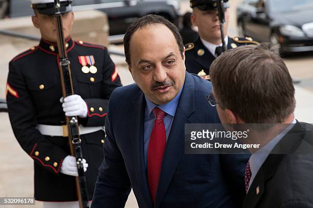 To R, Qatar's Minister of State for Defense Affairs Dr. Khalid bin Mohammed al Attiyah speaks with U.S. Secretary of Defense Ash Carter as they walk...