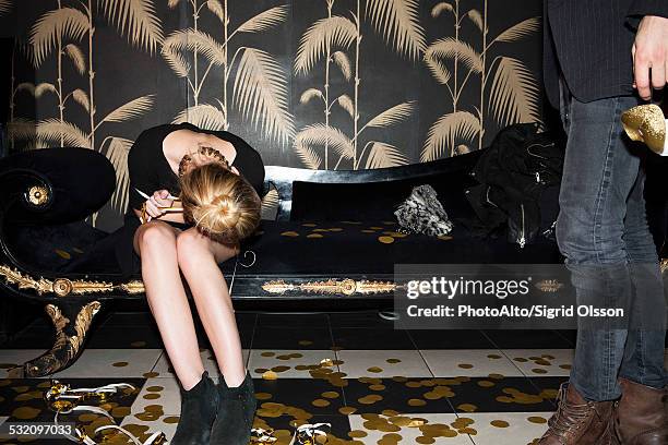 woman resting head on lap after party - drunk stock pictures, royalty-free photos & images