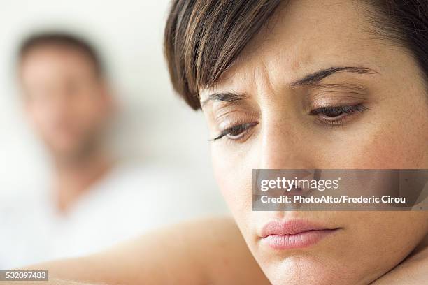 woman contemplative and withdrawn after disagreement with husband - partner violence stock pictures, royalty-free photos & images