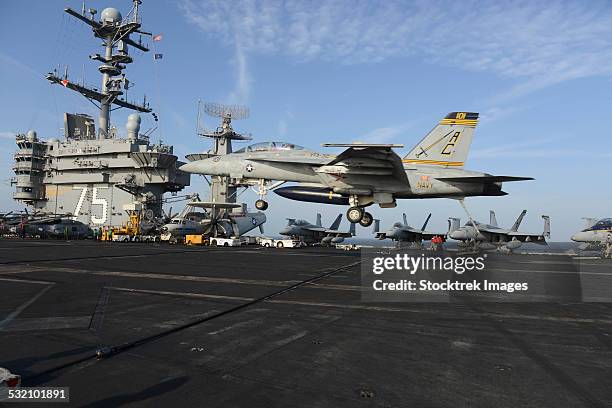 an f/a-18f super hornet lands on the flight deck of uss harry s. truman. - landing on aircraft carrier stock pictures, royalty-free photos & images