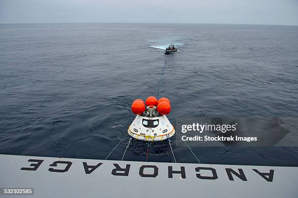 recovery of the orion crew module. - space capsule stock pictures, royalty-free photos & images