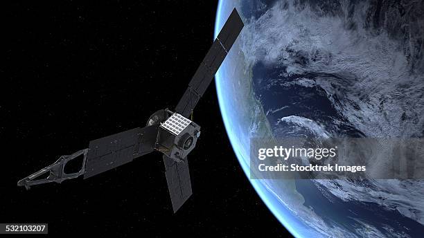 artists concept of nasas juno spacecraft during its earth flyby gravity assist. - exploratory spacecraft stock-grafiken, -clipart, -cartoons und -symbole