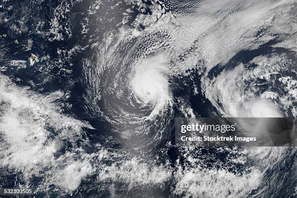 august 4, 2014 - hurricane iselle and hurricane julio over the pacific ocean. - eye of the storm stock pictures, royalty-free photos & images