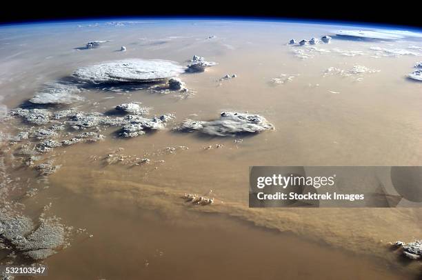 view of a dust storm that stretches across the sand seas of the sahara desert. - dust storm stock pictures, royalty-free photos & images