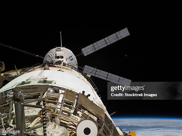 the johannes kepler automated transfer vehicle docks to the international space station. - johannes kepler stock pictures, royalty-free photos & images