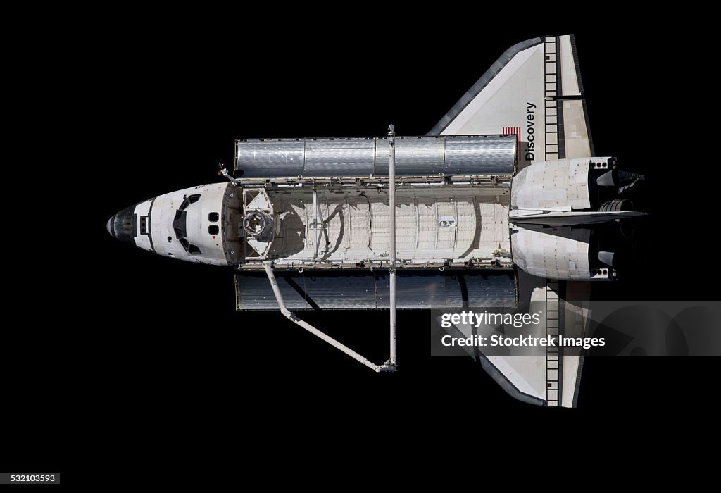 March 7, 2011 - Space shuttle Discovery backdropped against the blackness of space.