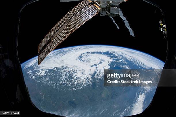 tropical cyclone located over northern saskatchewan, canada. - iss window stock pictures, royalty-free photos & images
