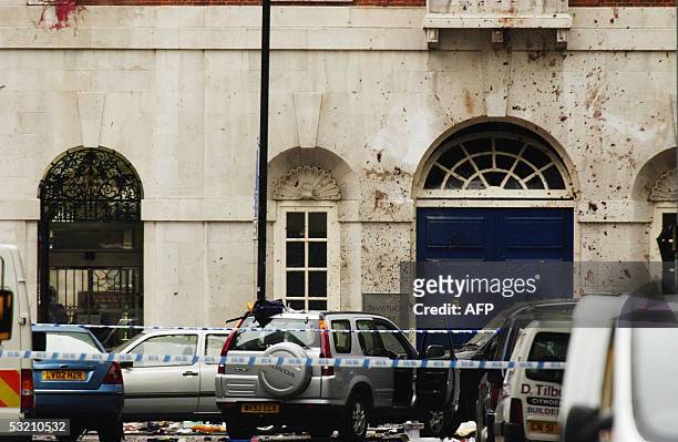 London, UNITED KINGDOM: Blood and shrapnel holes are seen on the wall of the British Medical Association near where a double-decker bus was destroyed...