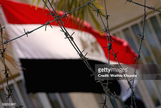 An Egyptian flag flutters at the Egyptian embassy on July 8, 2005 in Baghdad, Iraq. The Iraqi government called on the nations of the world to keep...
