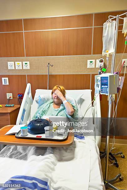 caucasian woman in hospital looks at meal with disgust - hospital food stock pictures, royalty-free photos & images