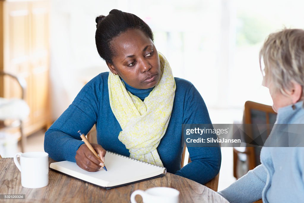 Social worker meeting a client