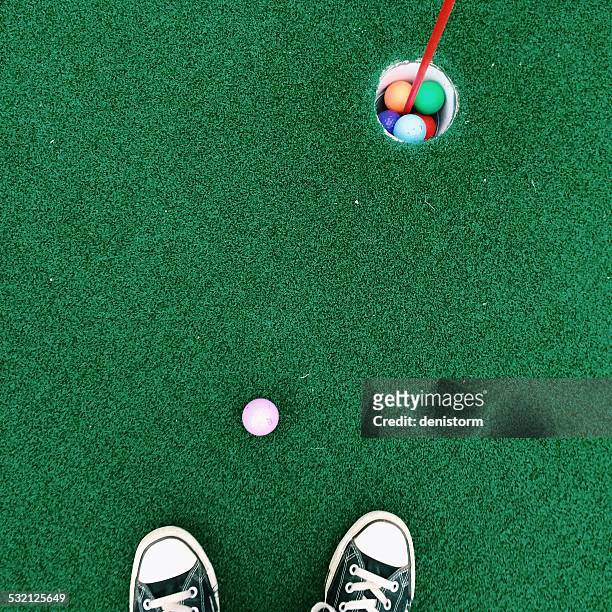 feet on putting green - miniature golf stock pictures, royalty-free photos & images