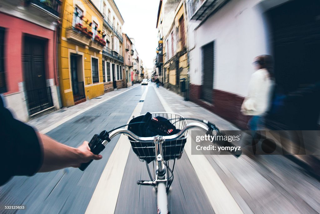 Hand holding handle bar on bike