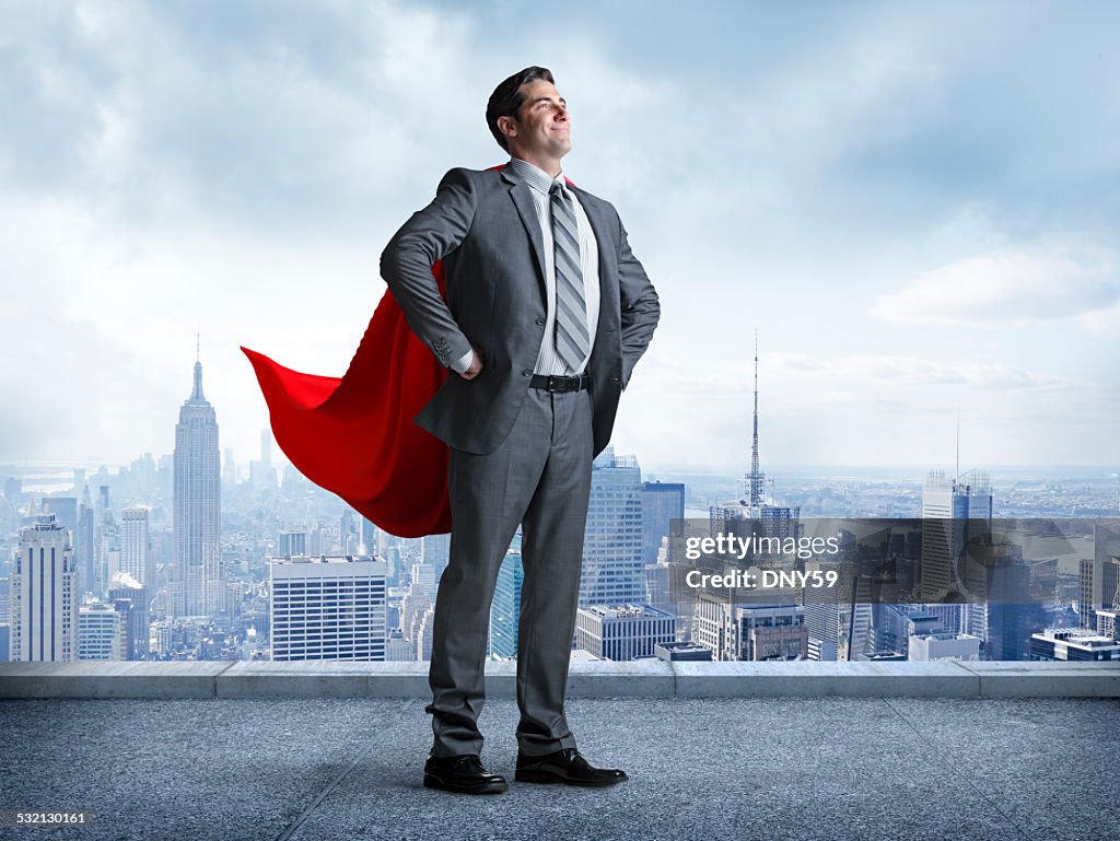 Superhero Businessman With Cityscape In The Background