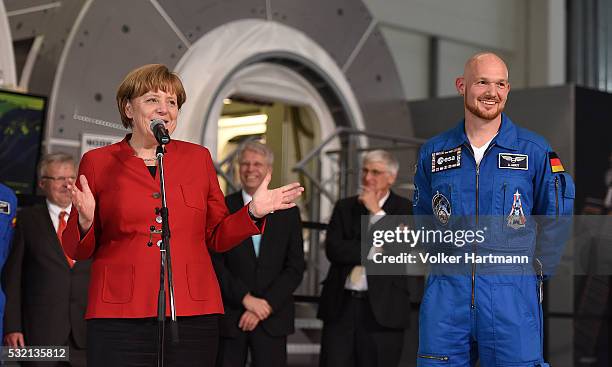 The German Chancellor Angela Merkel speaks next to german astronaut Alexander Gerst in the astronauts training hall during a visit of the European...