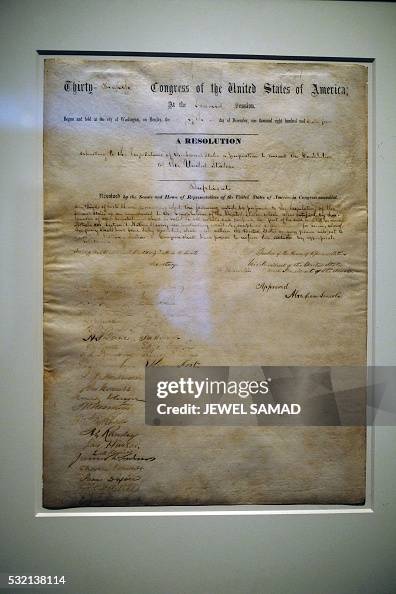The 13th Amendment signed by President Abraham Lincoln, is displayed ...