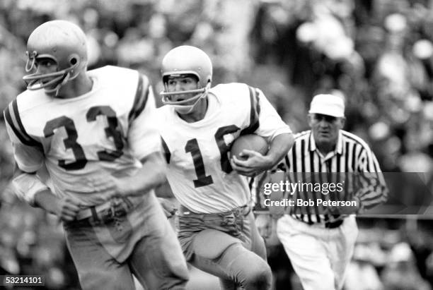 American college football player Gary Beban , quarterback for UCLA, runs with the ball during game against University of Pittsburgh, Pittsburgh,...