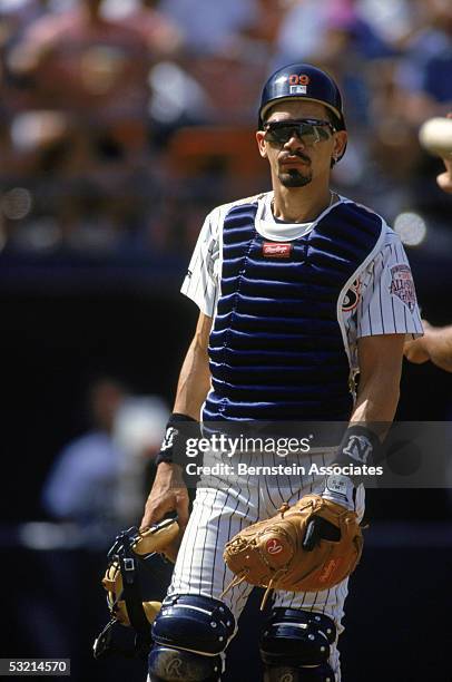 Catcher Benito Santiago of the San Diego Padres looks on the field during a May 21,1992 season game. Benito Santiago played for the San Diego Padres...