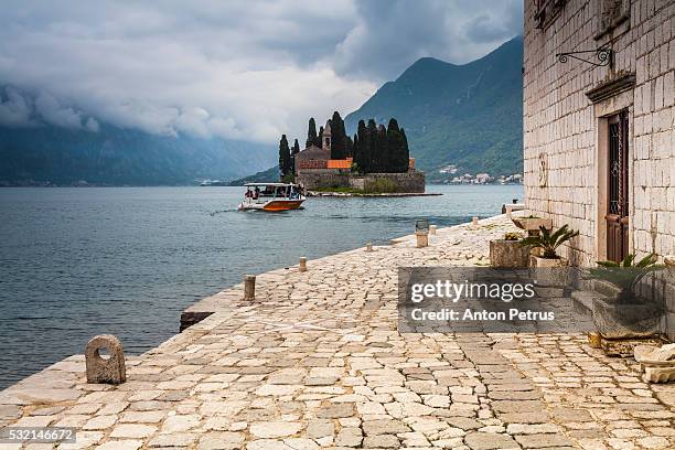 our lady of the rocks church (gospa od skrpjela) on bay of kotor in perast, montenegro - our lady of the rocks stock pictures, royalty-free photos & images