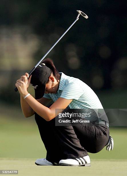 Michelle Wie of the USA reacts after missing a bogie putt on the 6th hole during the second round of the John Deere Classic on July 8, 2005 at TPC at...