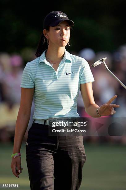 Michelle Wie of the USA walks off the 9th green after failing to make the cut during the second round of the John Deere Classic on July 8, 2005 at...