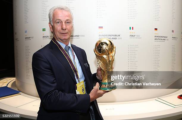 Vice President Rainer Bonhof of Borussia Moenchengladbach with the Fifa World Cup Trophy during he visit the Fifa Museum at day three of Borussia...