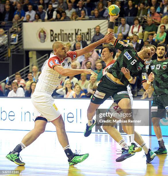 Zeljko Musa, Nemanja Zelenovic of SC Magdeburg and Drago Vukovic of Fuechse Berlin during the game between Fuechse Berlin and dem SC Magdeburg on May...