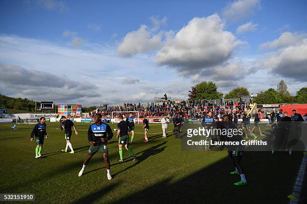 The AFC Wimbledon players warm up prior to kickoff during the Sky Bet League Two play off, Second Leg match between Accrington Stanley and AFC...
