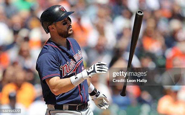 Trevor Plouffe of the Minnesota Twins reacts after striking out to end the fourth inning of a game against the Detroit Tigers on May 18, 2016 at...