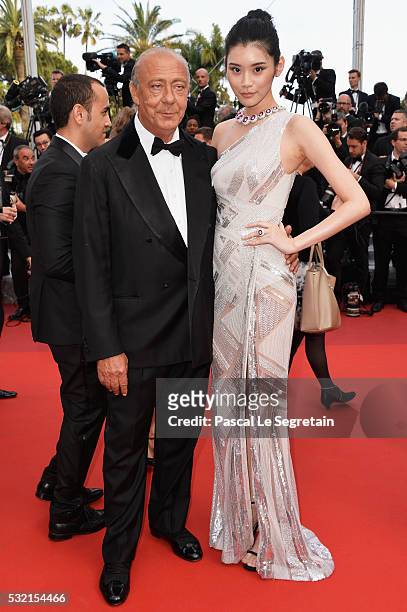 Fawaz Gruosi and Ming Xi attend "The Unknown Girl " Premiere during the 69th annual Cannes Film Festival at the Palais des Festivals on May 18, 2016...