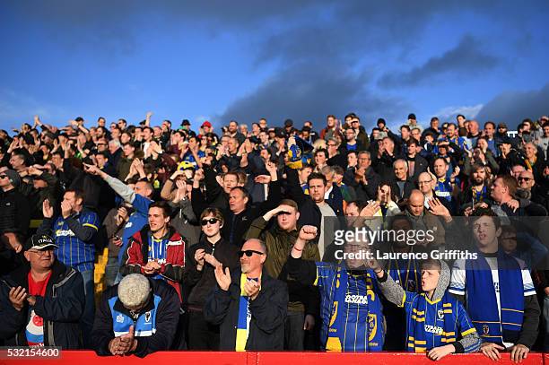 Wimbledon fans cheer on their team during the Sky Bet League Two play off, Second Leg match between Accrington Stanley and AFC Wimbledon at The Crown...