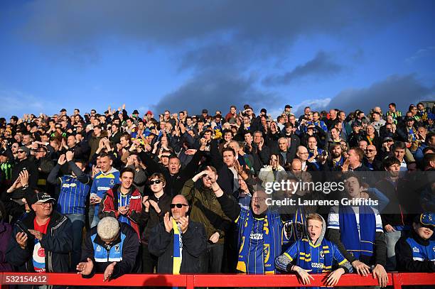 Wimbledon fans cheer on their team during the Sky Bet League Two play off, Second Leg match between Accrington Stanley and AFC Wimbledon at The Crown...