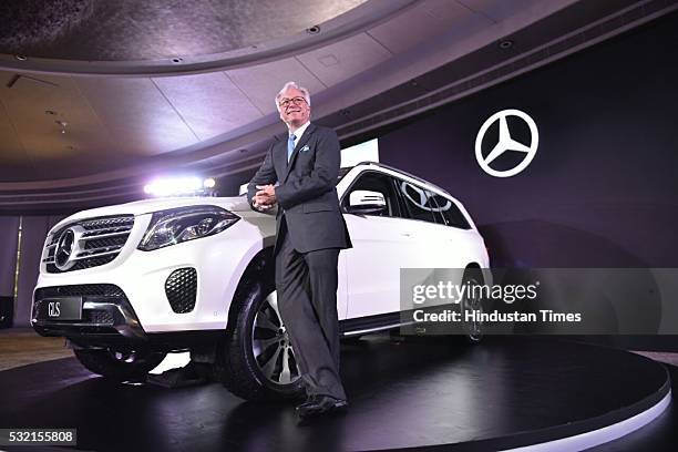 Roland Folger, Managing Director and CEO, Mercedes Benz, poses with the Mercedes Benz GLS 350d car during its launch on May 18, 2016 in New Delhi,...