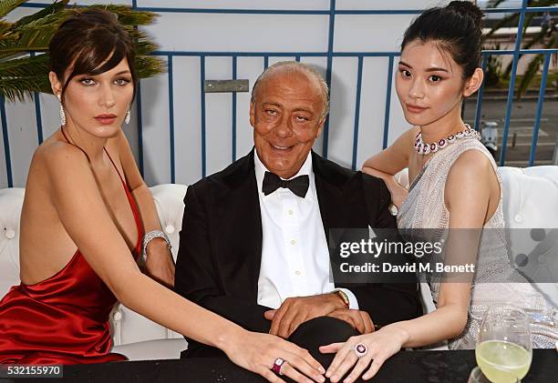 Bella Hadid, Fawaz Gruosi and Ming Xi attend a performance by Seal at the de Grisogono showroom, Terrace 'Les Oliviers', during the 69th Cannes Film...