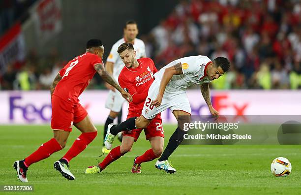 Vitolo of Sevilla and Adam Lallana of Liverpool compete for the ball during the UEFA Europa League Final match between Liverpool and Sevilla at St....