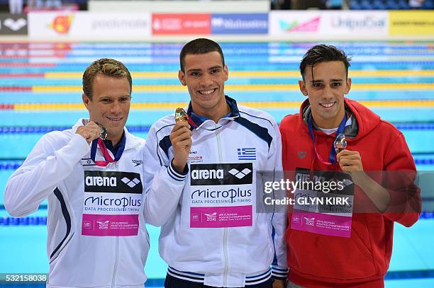 Gold medalist Greece's Andreas Vazaios poses for a photograph with silver medalist Israel's Gal Nevo and bronze medalist Portugal's Alexis Manacas...